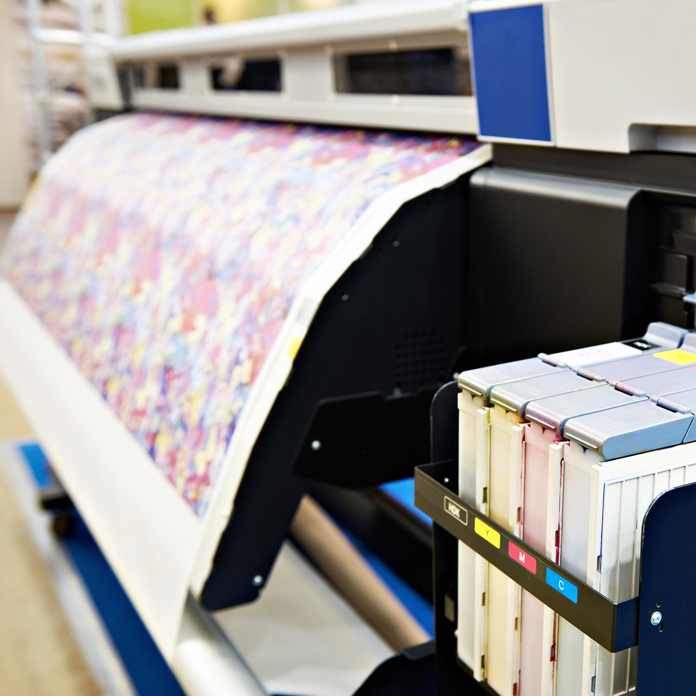 Wide format printer for on fabric and paper